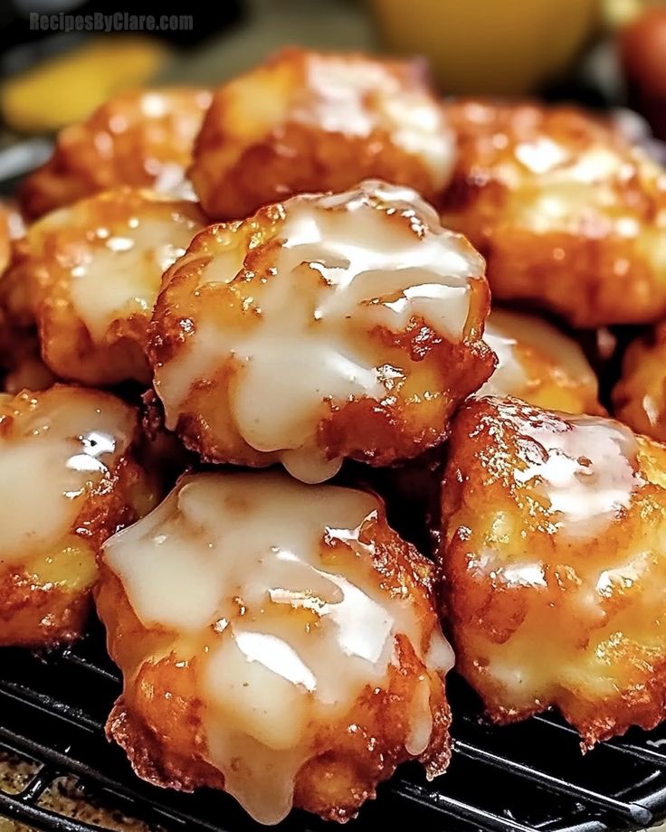 glazed donuts sitting on top of a black grill