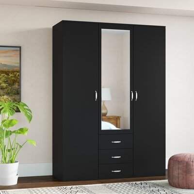 a black armoire with mirrored doors in a room