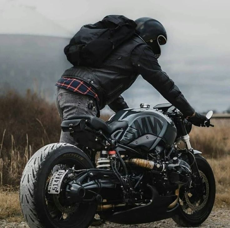 a man riding on the back of a motorcycle