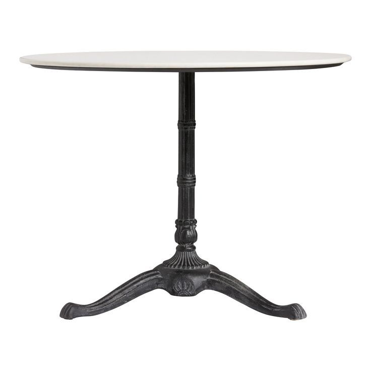 a white table with black legs and an iron base on the top, against a white background