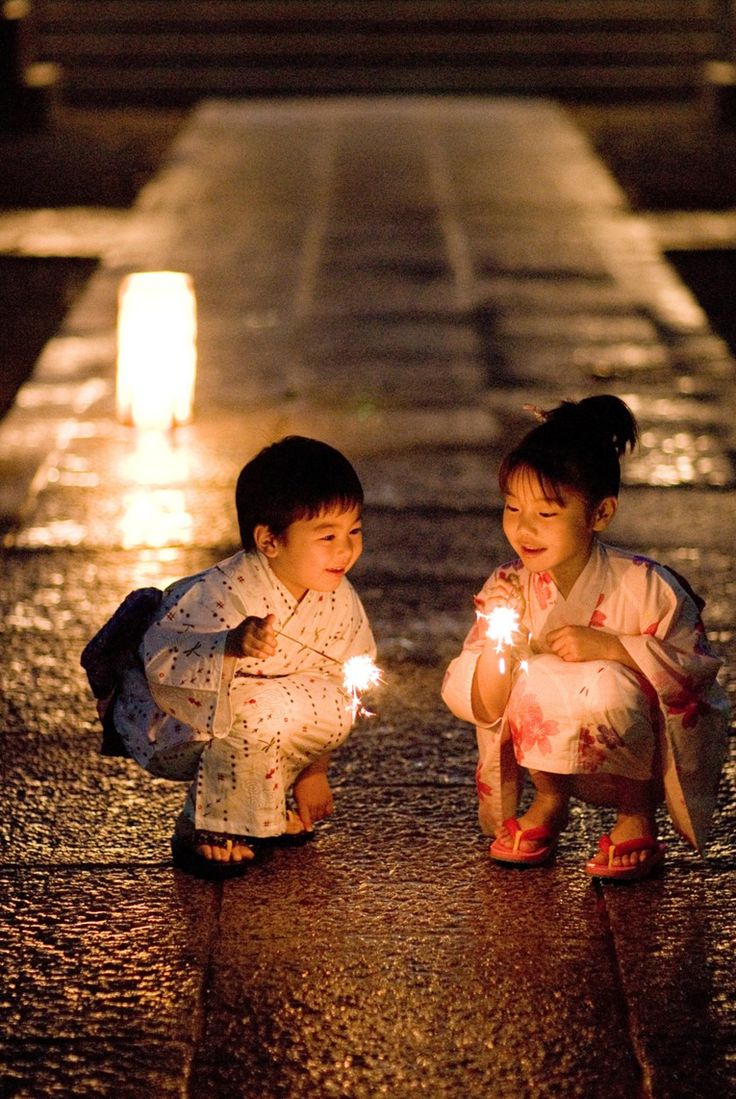 two children holding sparklers in their hands with the caption saying,'i love you