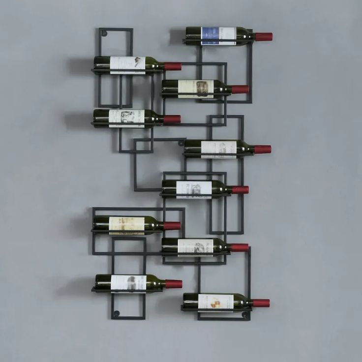 several bottles of wine are arranged on the wall to form a rack for each bottle