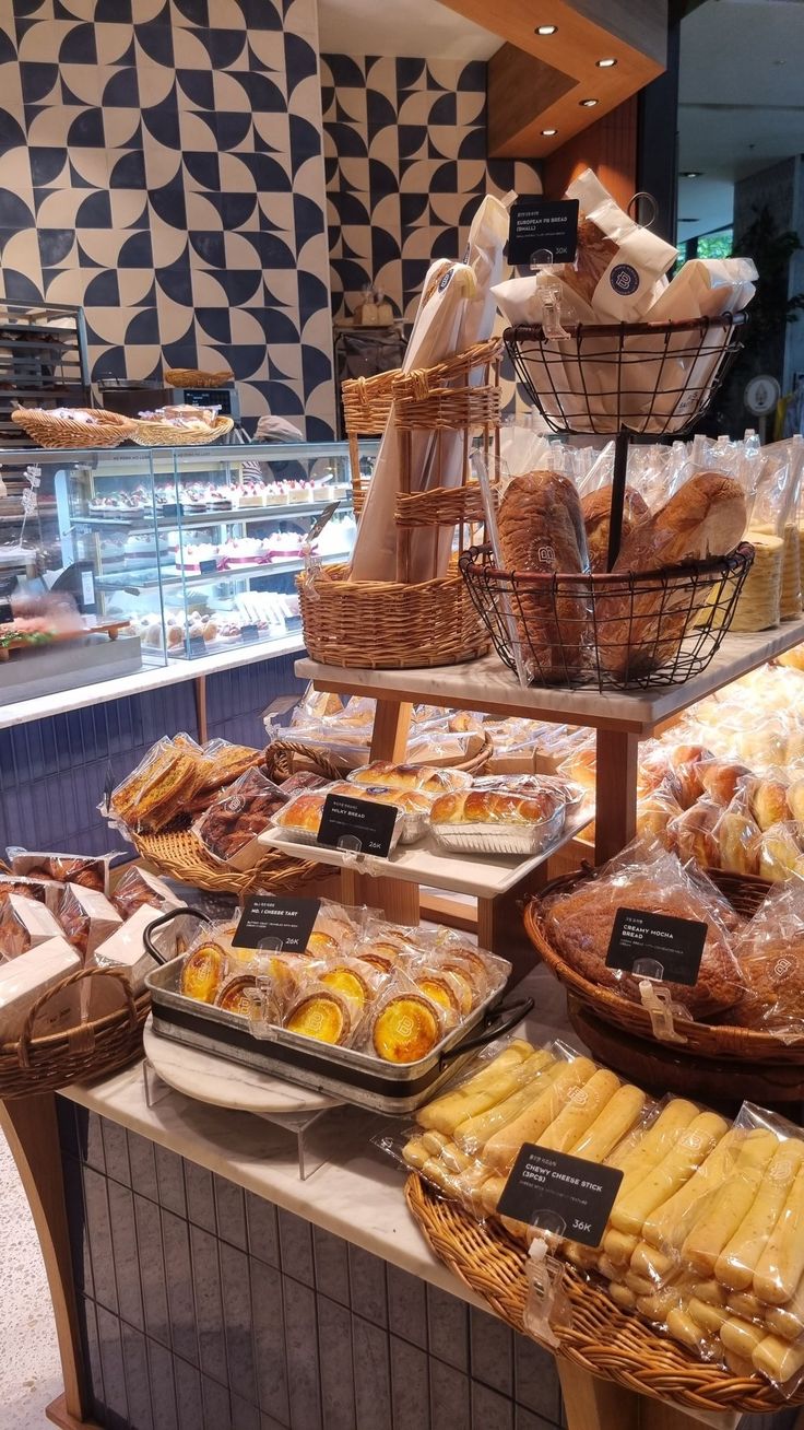 breads and pastries on display in a bakery