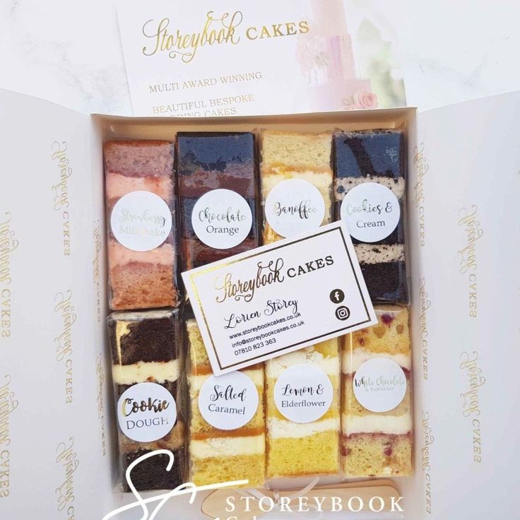 a box filled with lots of different types of cakes