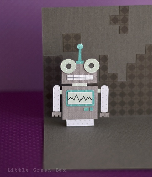 a card with a robot made out of paper