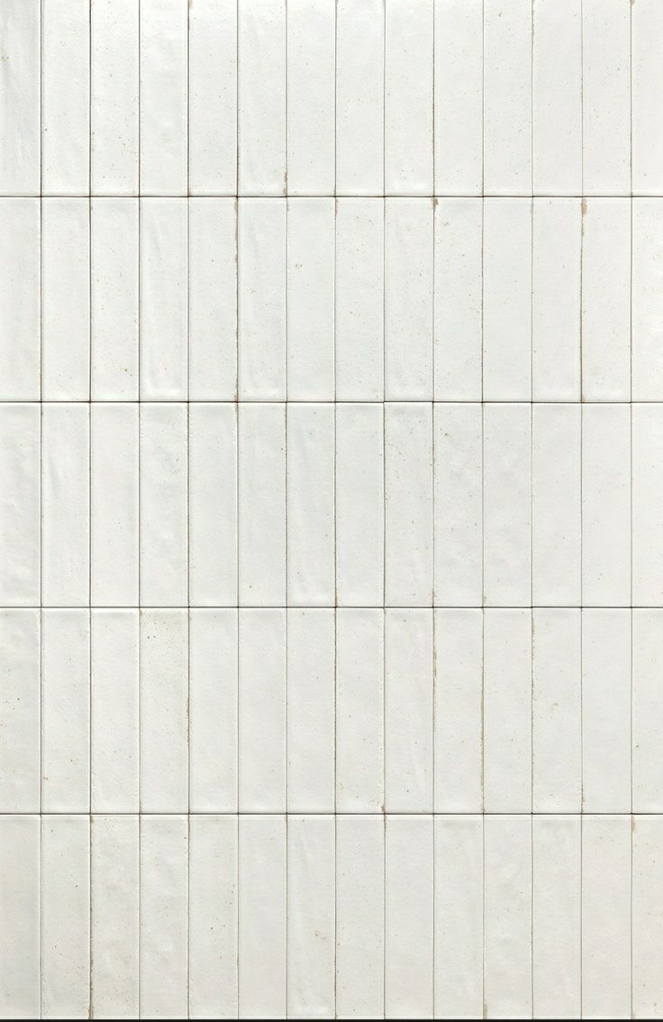 a white tiled wall with no one in it