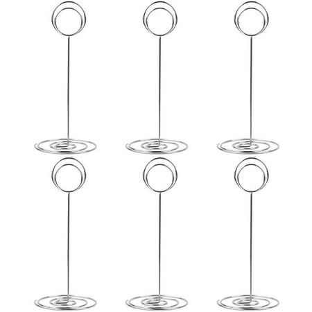 four circles are connected to each other by wire on a white background with one circle in the middle