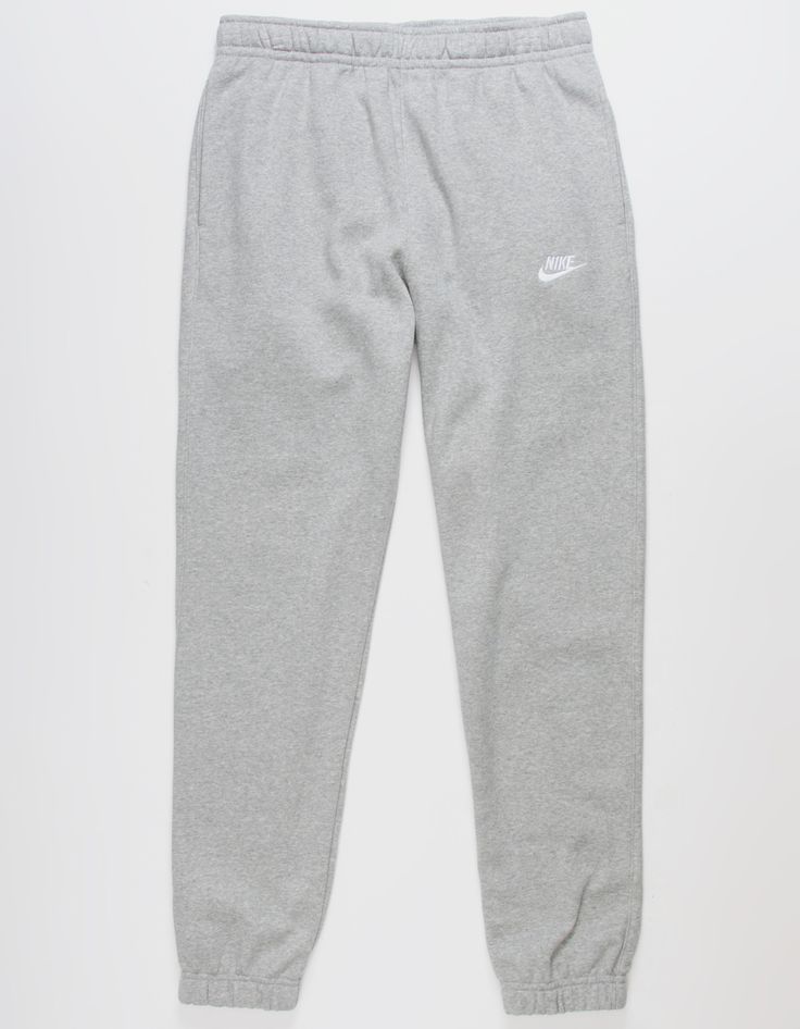 Nike Sportswear Club Fleece Sweatpants. Combines Classic Style With The Soft Comfort Of Fleece. Standard Fit Has A Relaxed, Easy Feel. Tapered Leg. Elastic Waistband. Side Pockets. Embroidered Logo On Left Leg. Elastic Cuffs. Fleece Lining. 80% Cotton 20% Polyester. Machine Wash. Imported. Grey Nike Sweatpants Outfits, Nike Sweatpants Outfit, Gray Nike Sweatpants, Grey Nike Sweats, Jogging Nike, Grey Nike Sweatpants, Sweatpants Nike, Cute Sweatpants, Nike Sportswear Club Fleece