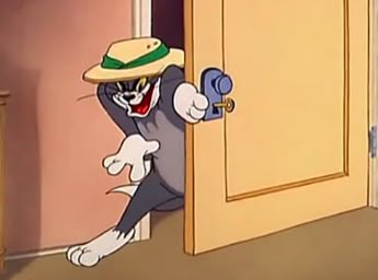 an animated cat wearing a hat peeking out from behind a door