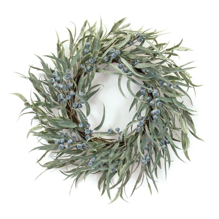 a wreath with blue berries and green leaves