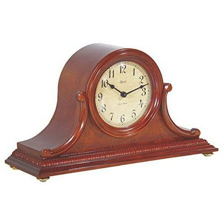 a wooden clock with roman numerals on the front and sides, sitting on a white background