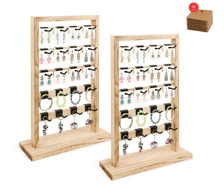 two wooden display racks with earrings on them