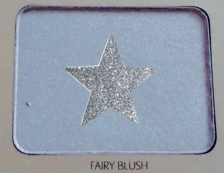 a silver glitter star on a white background with the words fairy blush written below it