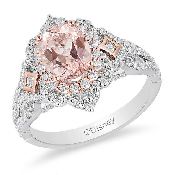 a fancy ring with an oval pink diamond surrounded by white and rose gold pave