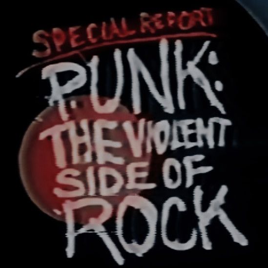 graffiti on the side of a building reads, punk the violent side of rock '