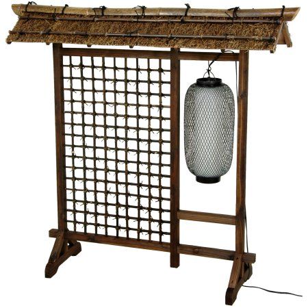 Four foot tall Oriental room divider with multiple decorative components. Open lattice features fiber ties at each joint. Hanging black electric lantern is wired for American light bulbs and plugs into a standard American outlet. Rustic thatched roof of natural fiber has bamboo poles stained a dark walnut. Footed triangular feet add stability and style. A bold, practical Oriental light and divider for the home or office. Size: 51 inch. Color: Brown. Tall Lanterns, Fabric Room Dividers, Portable Room Dividers, Glass Room Divider, Bamboo Room Divider, Bamboo Lantern, 4 Panel Room Divider, Hanging Room Dividers, Folding Room Dividers