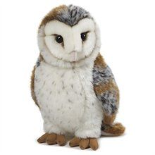 an owl stuffed animal sitting on top of a white surface