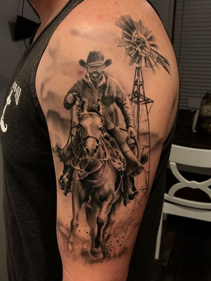 a man with a cowboy tattoo on his arm is riding a horse and holding a windmill