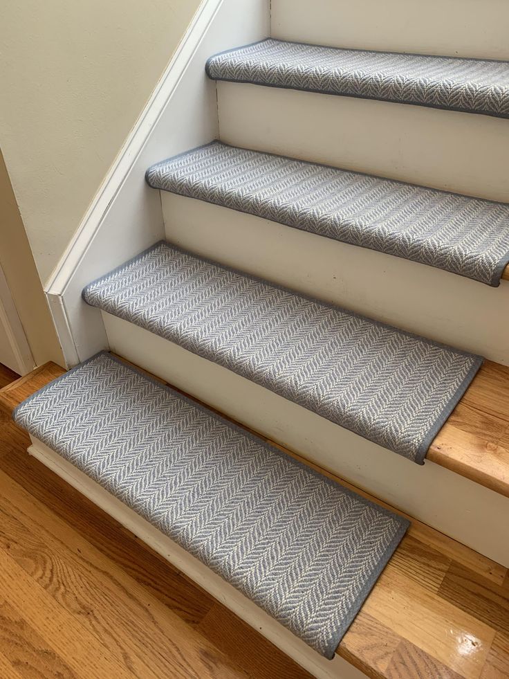 a set of stairs with carpeted treads