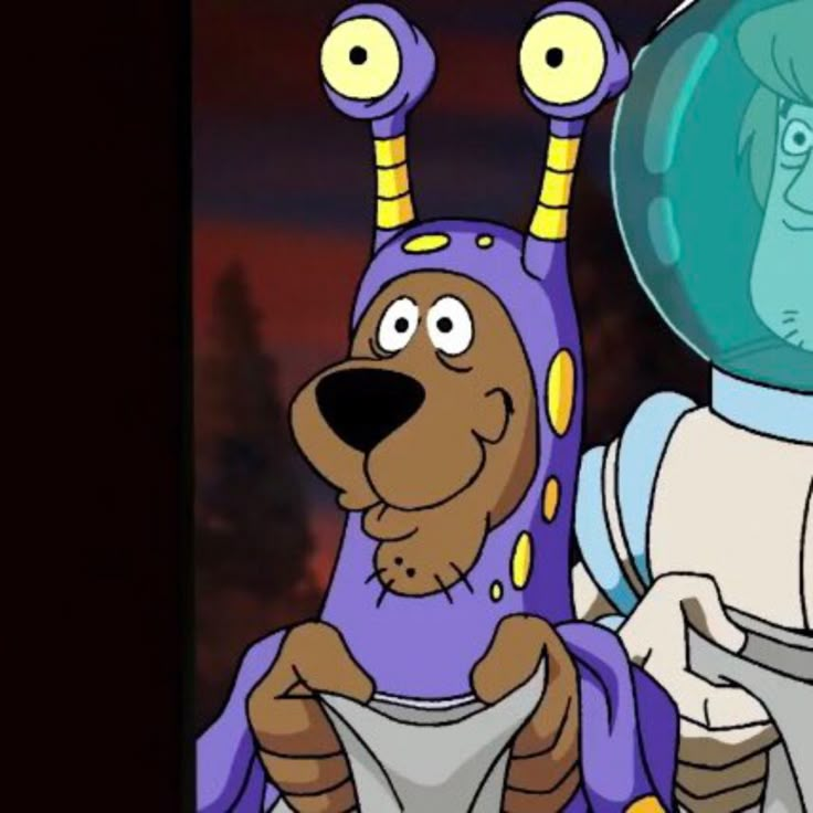 an animated image of a dog wearing a space suit next to a man in a space suit