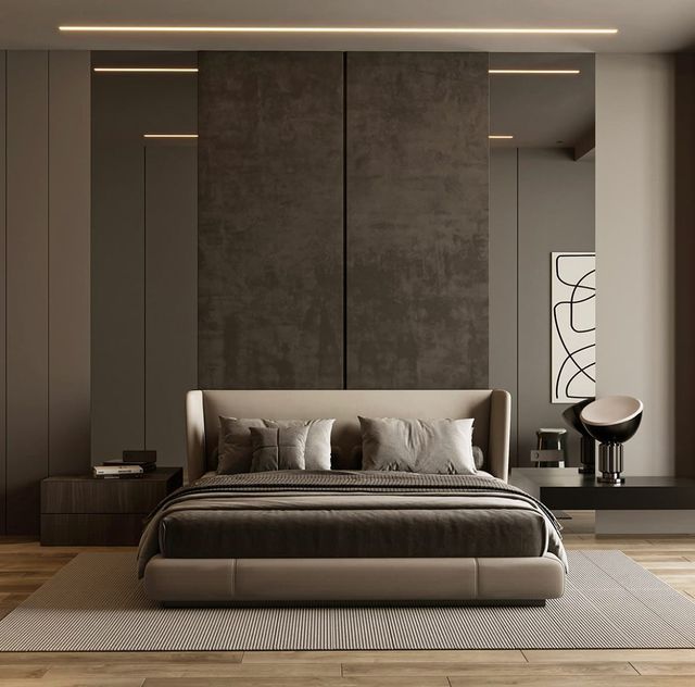 a bedroom with a large bed and two stools in front of the headboard