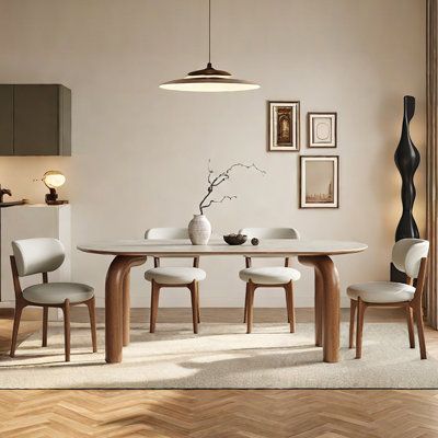 a dining table with four chairs around it