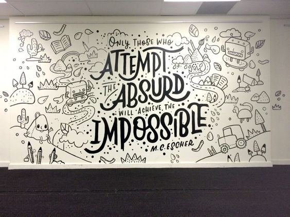 a large mural on the wall in an office with black and white lettering that reads, attempt about impossible