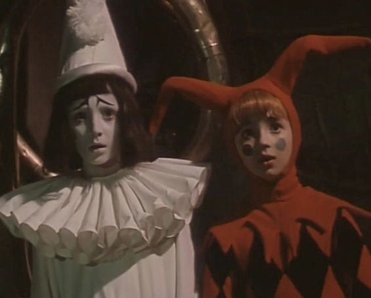 two children dressed in costumes standing next to each other