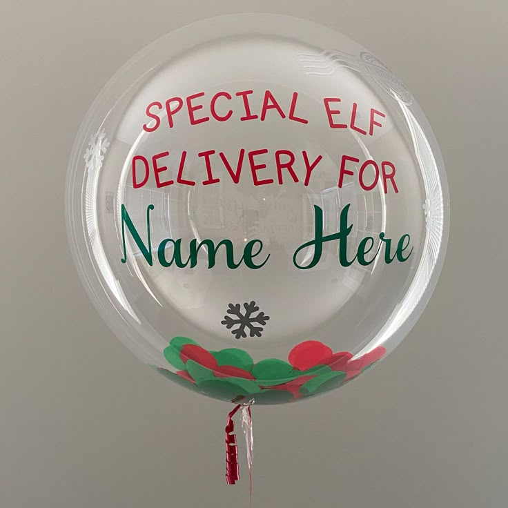 a clear balloon with the words special elf delivery for name here on it