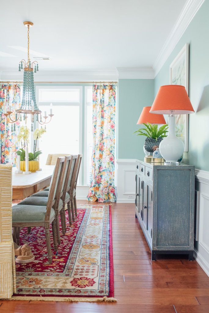 the dining room is clean and ready for us to use it's bright colors