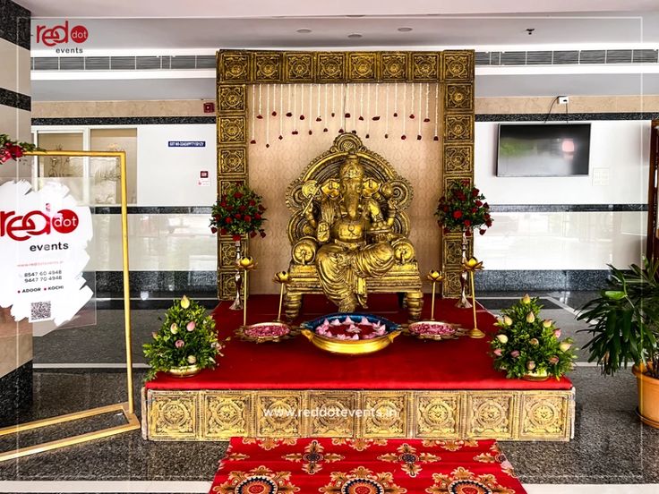 a golden statue sitting on top of a red rug