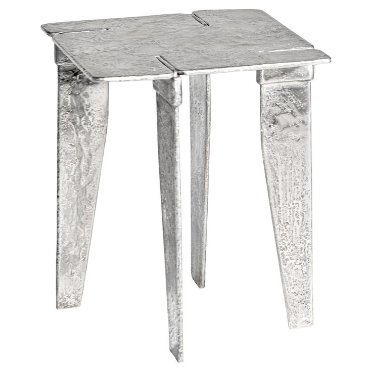 a small metal table with two legs