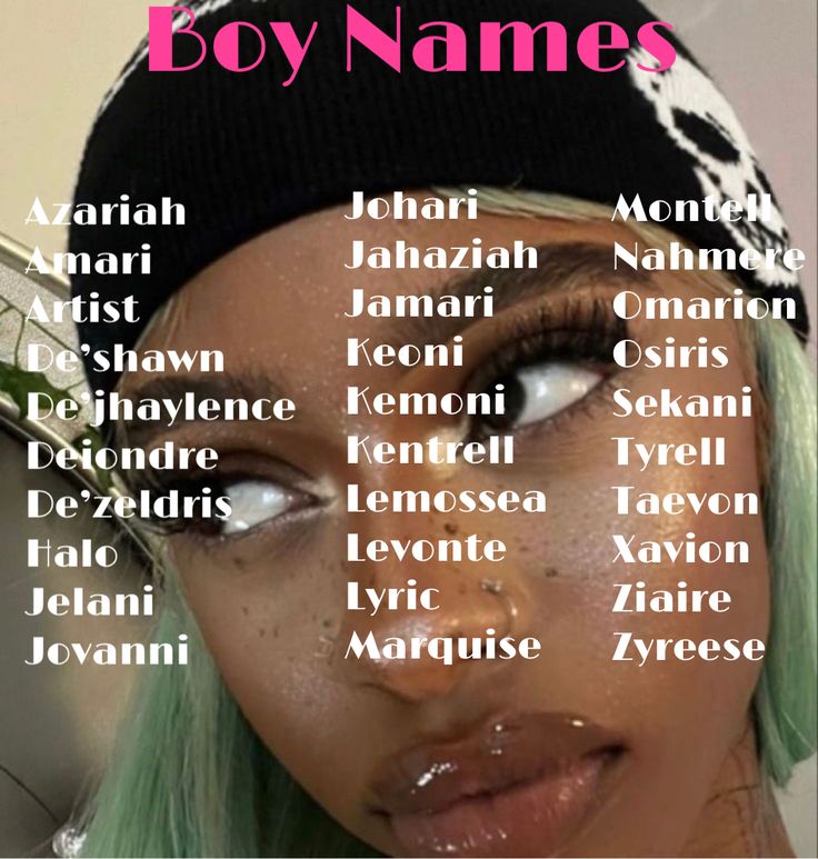 a woman with green hair and white makeup has her name written on the front of her face