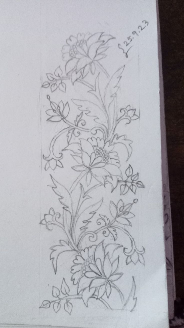 a drawing of flowers and leaves on paper