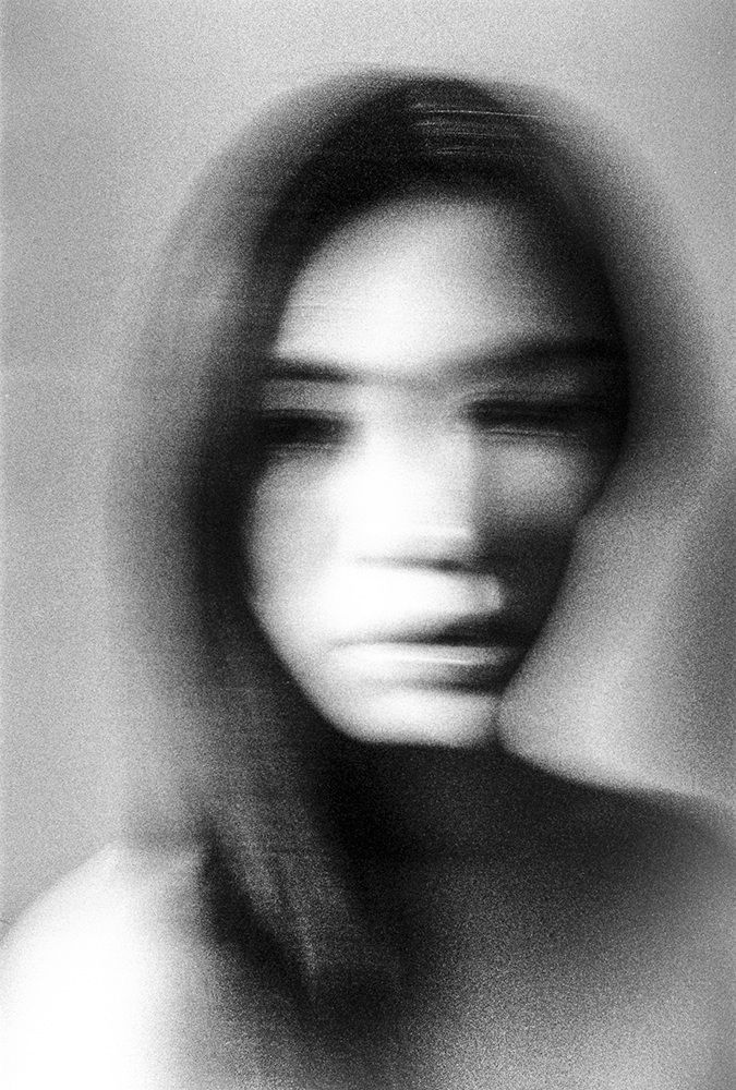 a blurry photo of a woman's face