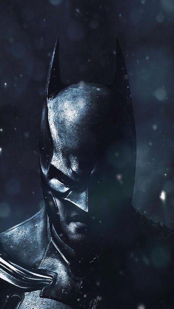 batman in the dark knight rises poster with snow falling around him and his head tilted to the side