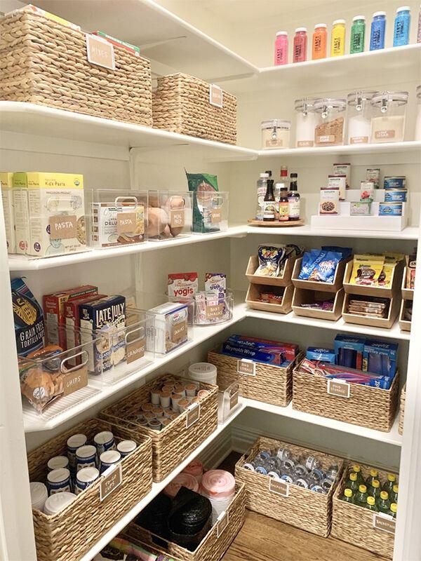 an organized pantry with baskets and food items