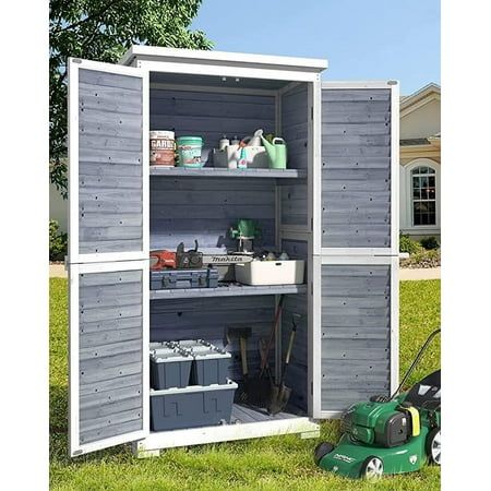 an outdoor storage shed with the door open and gardening tools in it's bins