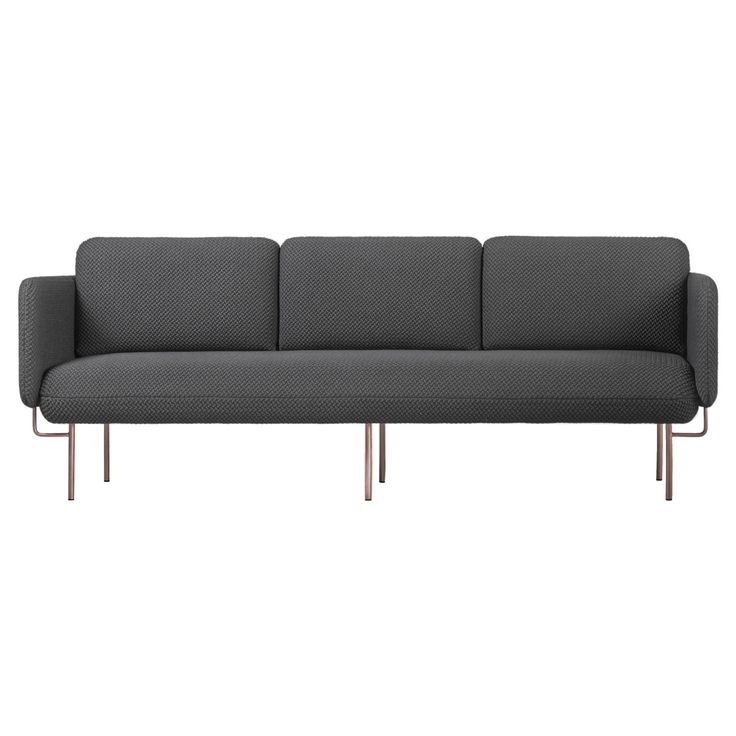 a gray couch sitting on top of a metal frame