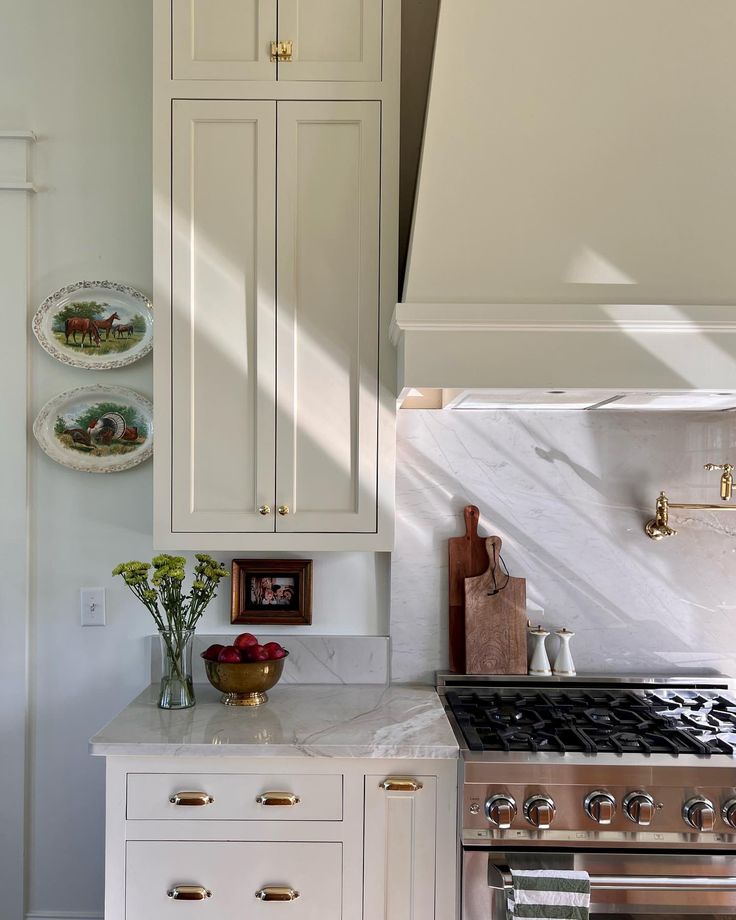 a kitchen with an oven, stove and cabinets in it's center island area