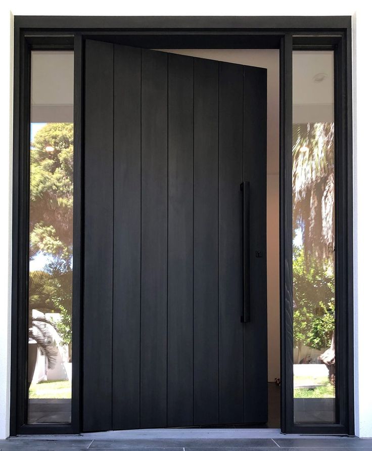 a black front door with two sidelights