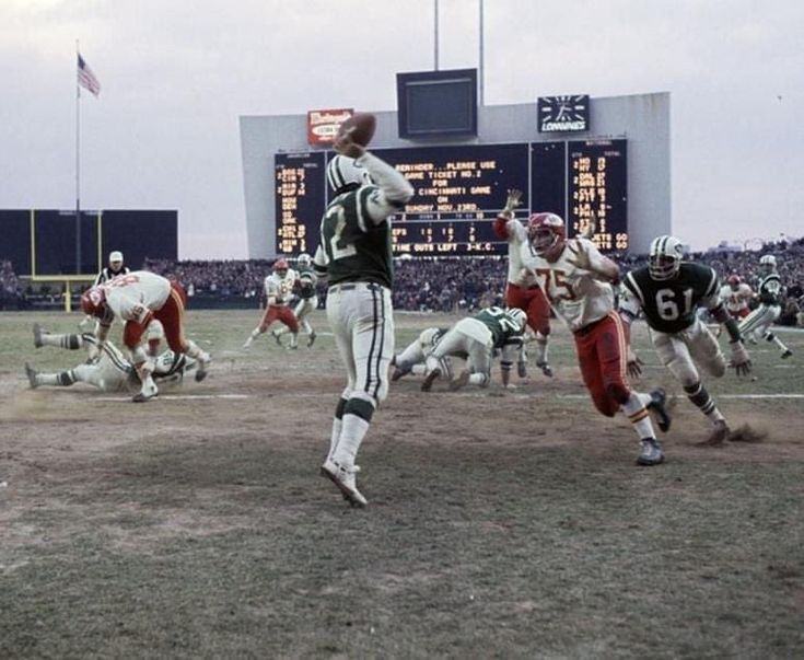 an old photo of a football game in progress