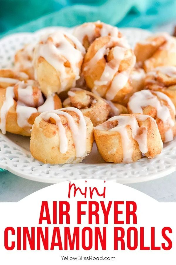 cinnamon rolls on a plate with icing drizzled over them and the words mini air fryer cinnamon rolls