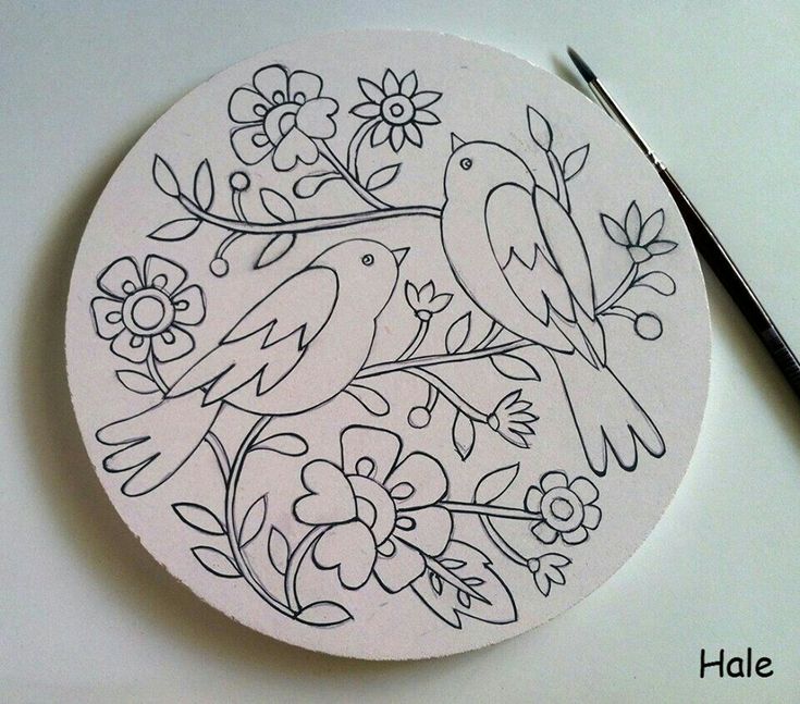 a drawing of two birds sitting on top of a flowered plate next to a pair of scissors