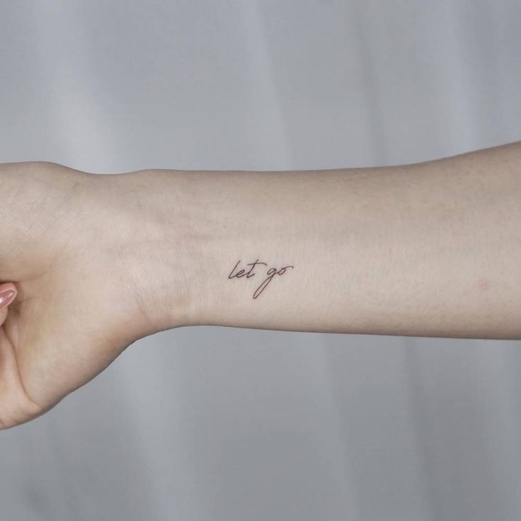 a person with a small tattoo on their arm