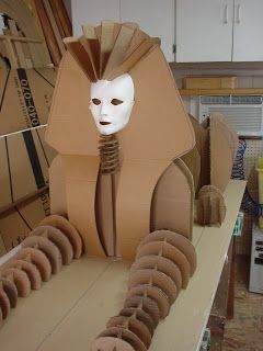 a cardboard mask sitting on top of a table