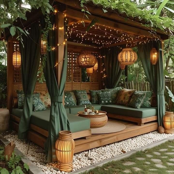 an outdoor living area with couches and lights