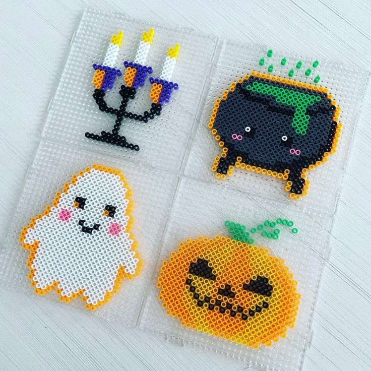 cross stitch halloween coasters with candles and pumpkins