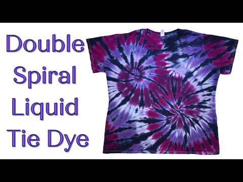 a purple and black tie - dyed shirt with the words double spiral liquid tie dye