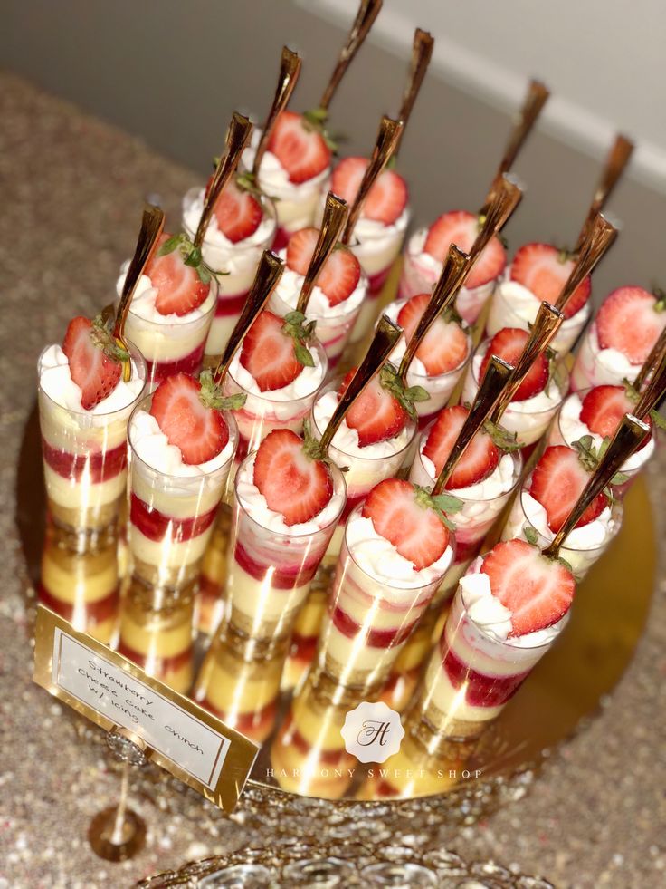 small desserts with strawberries are arranged on a table